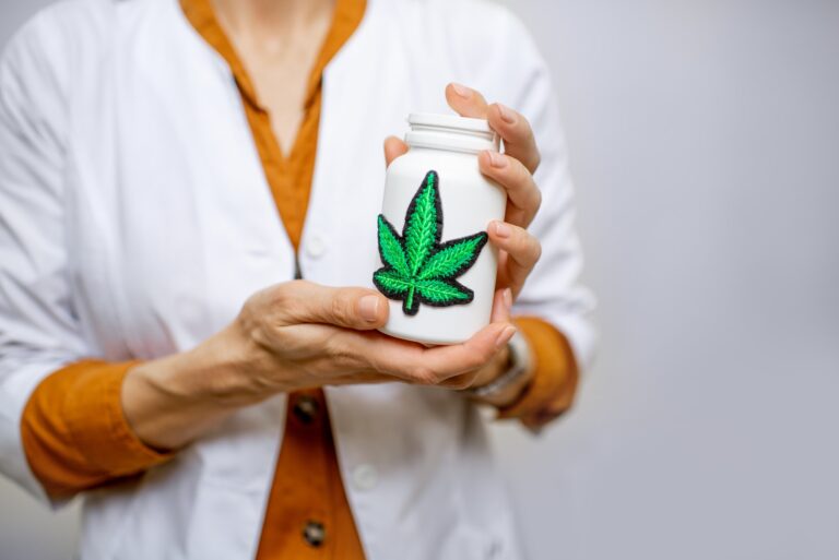 Holding a bottle with marijuana medication