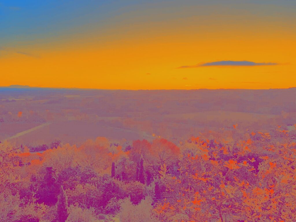 Psychedelic landscape and surreal orange sky, imagination and vision of an unreal planet